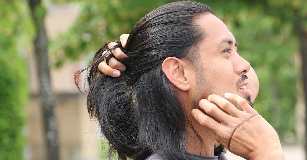 Gathering hair for the man bun