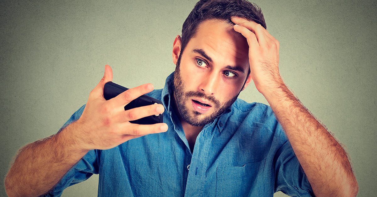 Man discovering receding hair