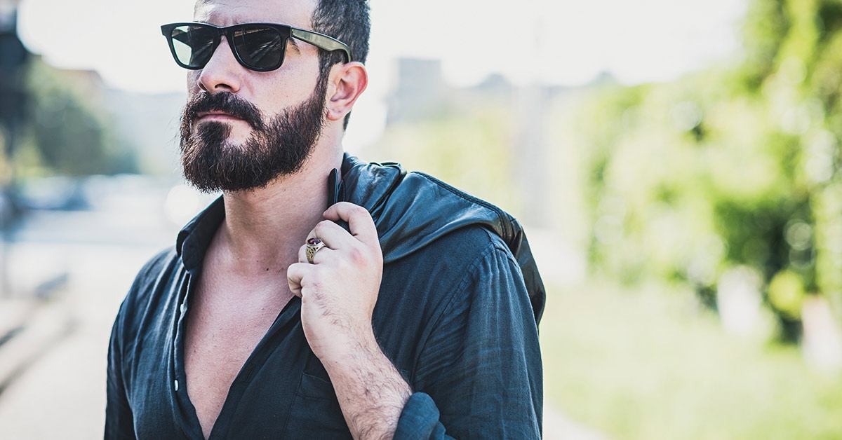 Man with full beard and dark sun glasses