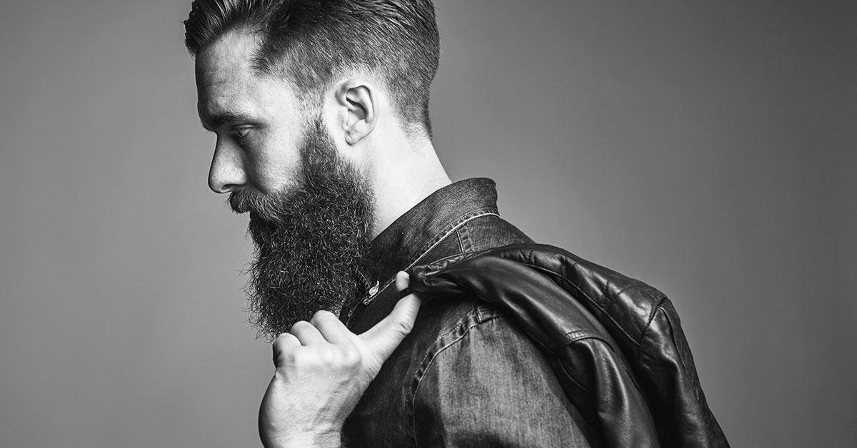 Man with leather jacket rocking the long beard