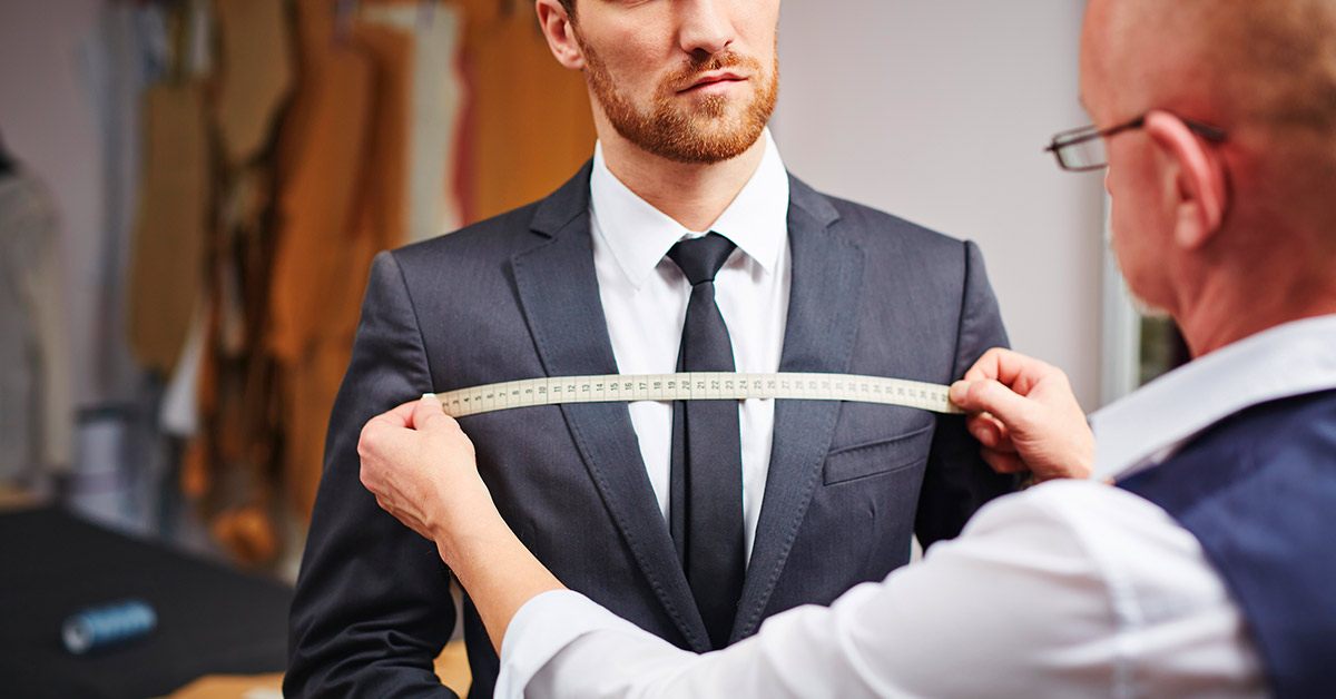 Tailor measuring tuxedo