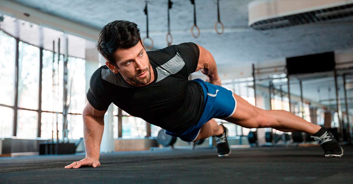 Man doing push-ups with one hand