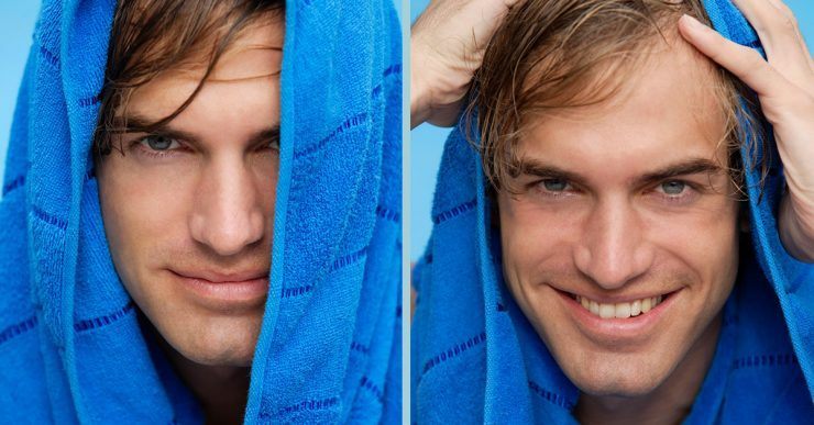 Man drying his hair with blue towel