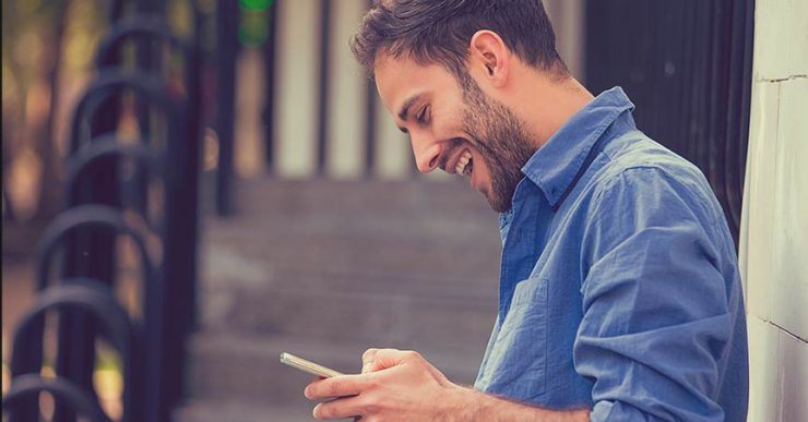 Happy man with smartphone