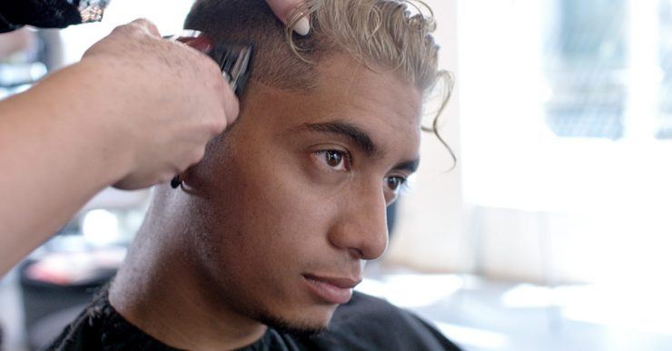 Man getting his sides trimmed by the hairdresser